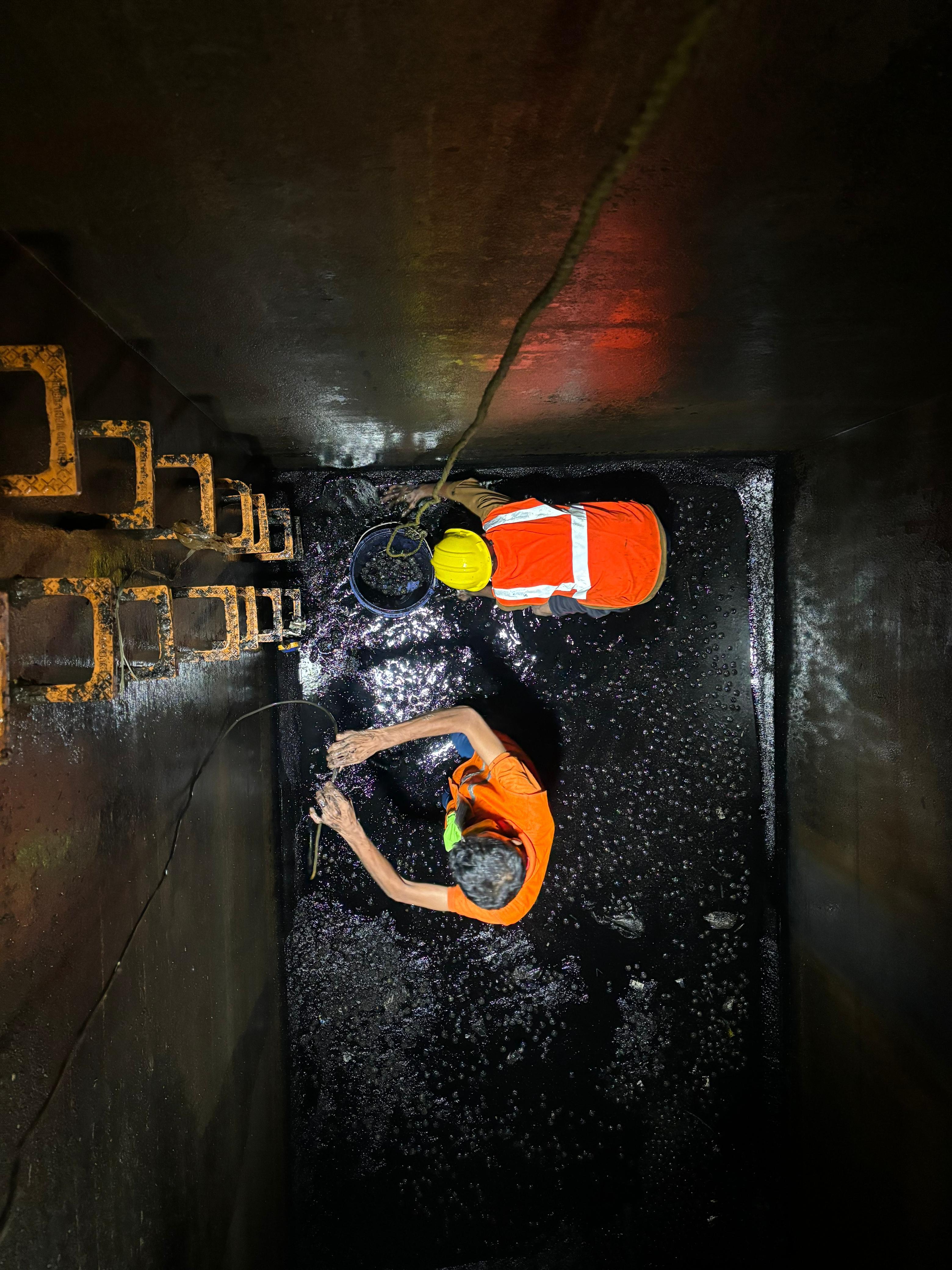 Before: sludge build-up in a commercial tank